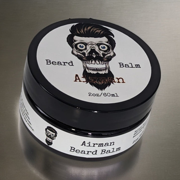 Airman 2oz beard balm jar with the Balboly bearded skull label